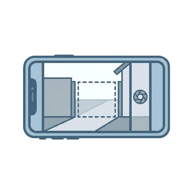 青とグレーのベクタースタイルで描かれたスマートフォンのアイコン。カメラアプリの画面には、設置予定場所を示す点線の枠が表示された屋外の現場写真が写っており、設置場所の確認や記録を表現しています。